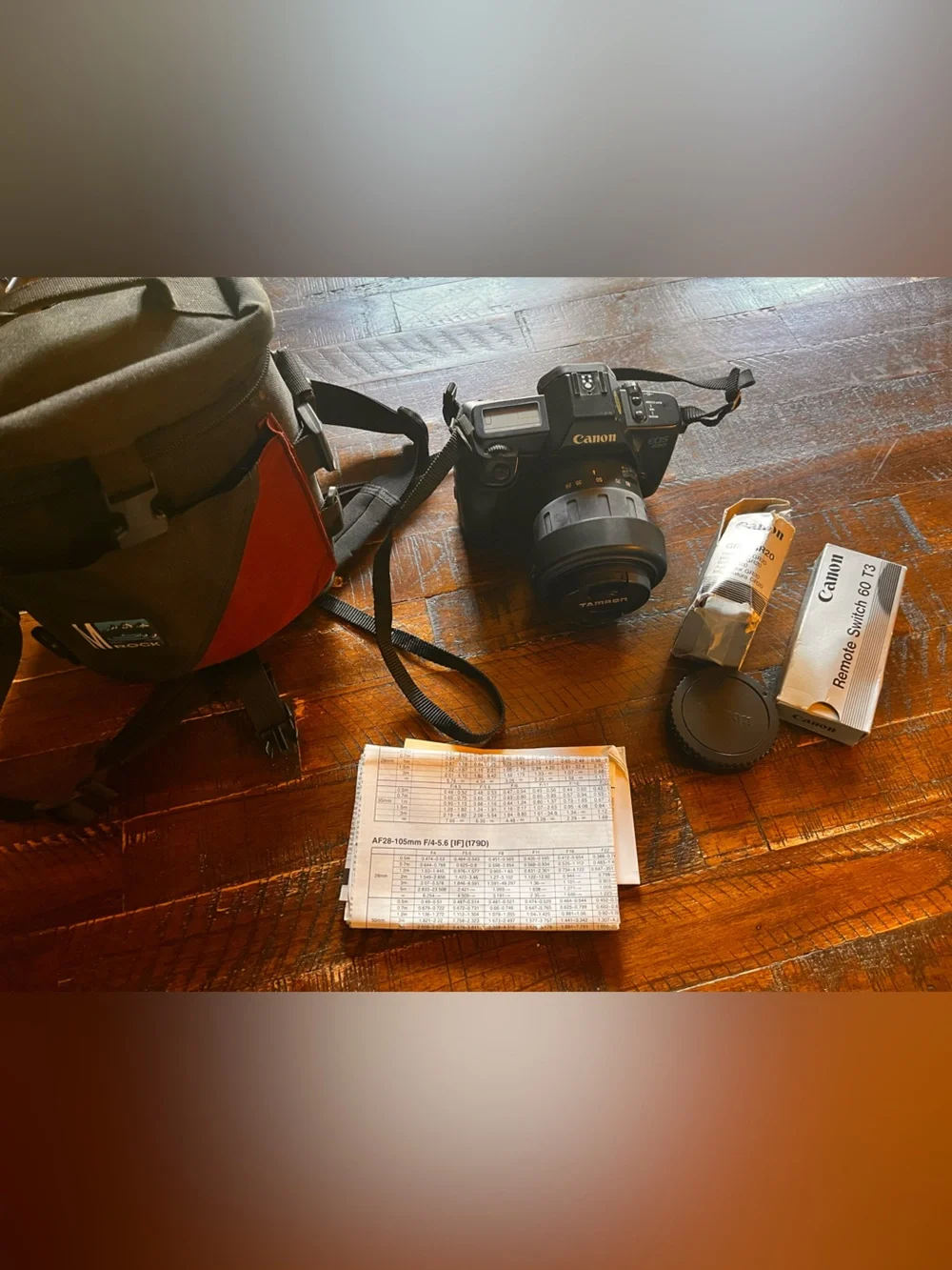 Canon Black DSLR Camera with Black Lens and Accessories